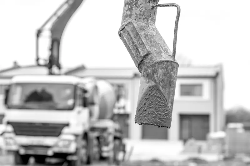 Concrete placement with a boom pump in the background